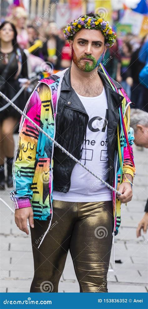 2019 A Man With A Rainbow Jacket And A Rainbow Beard Attending The Gay Pride Parade Also Known