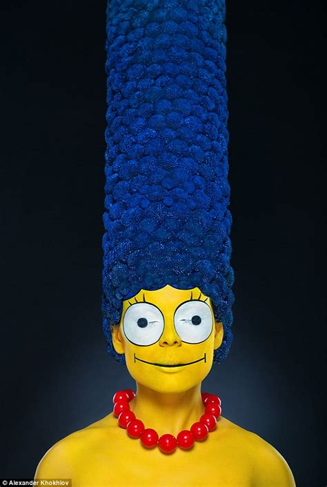 Model Transformed Into A Real Life Marge Simpson With A Towering Blue Bouffant Made Out Of Flowers