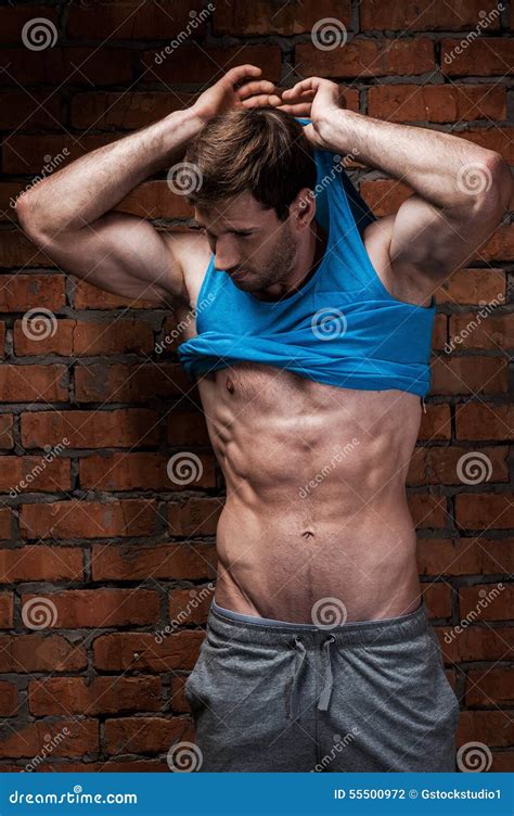 Man Undressing Stock Photo Image Of Arms Confidence
