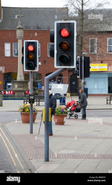 Red Traffic Lights At A Pedestrian Crossing In A Town In England Stock