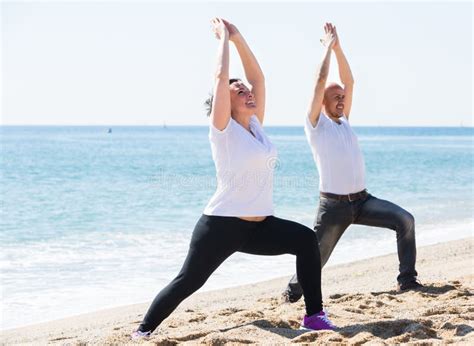 Couple Doing Yoga On The Beach Stock Image Image Of Healthy Portrait