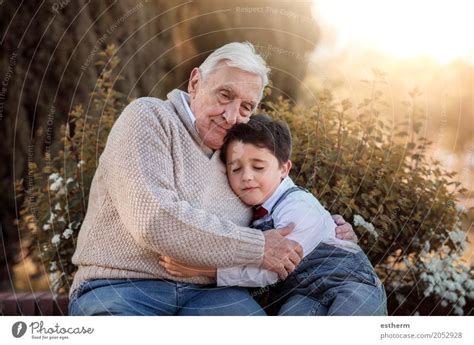 Portrait Of Grandfather And Grandson Embracing A Royalty Free Stock
