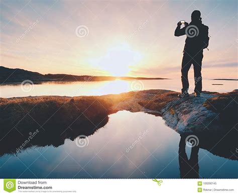 Tourist Guy Taking Pictures Of Amazing Sea Landscape On Mobile Phone