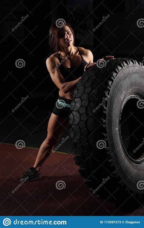 Fit Female Athlete Performing A Tire Flip Stock Image Image Of Body