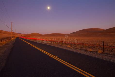 Romantic Country Road At Dusk Stock Photo Image Of Farmland Driving