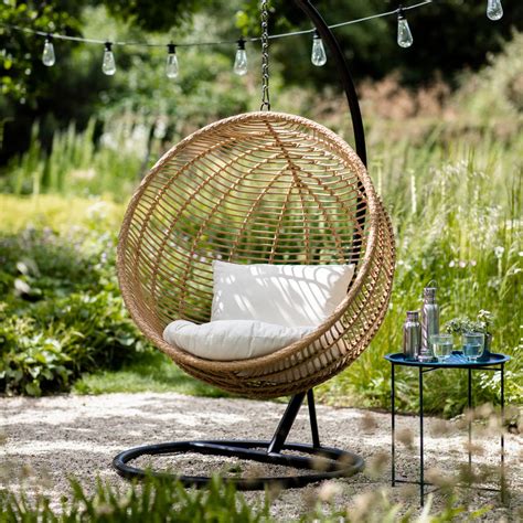 A wonderful table made of decorative bamboo lattice and wicker. All Weather Bamboo Hanging Nest Chair By All Things ...