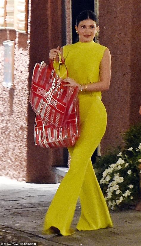 Kylie Jenner Dazzles In Neon Yellow Two Piece As She Holds Hands With
