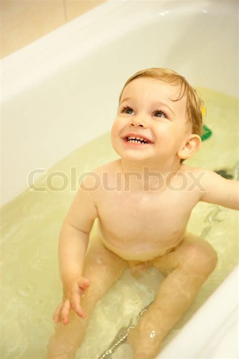 Little Boy Is Playing With Water In Bath Stock Photo Colourbox