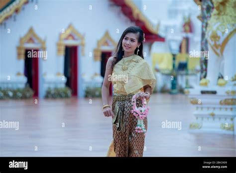 beautiful thai girl in traditional dress costume in phra that choeng chum thailand temple stock