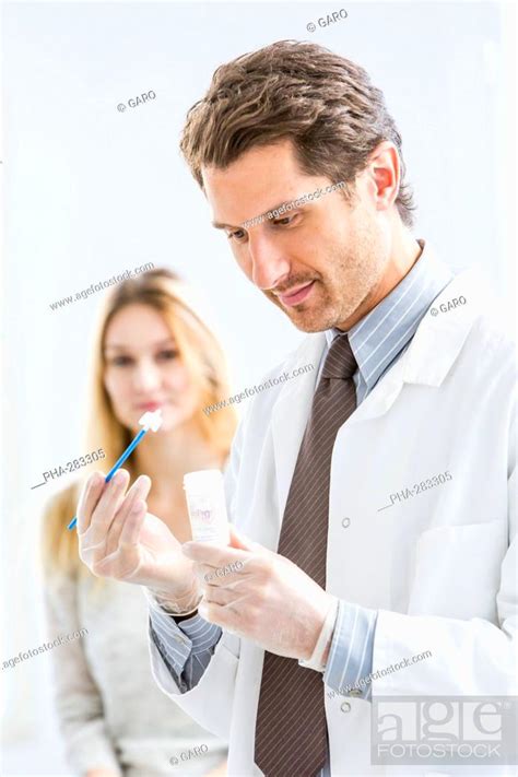Gynecologist Performing A Cervical Smear Or Pap Test On A Female