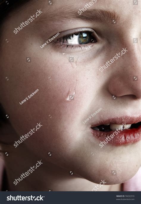 Portrait Of Little Girl Crying With Tears Rolling Down Her Cheeks Stock