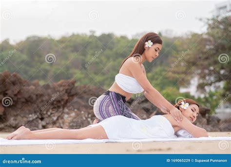beautiful asian woman enjoying spa massage therapy on the beach stock image image of