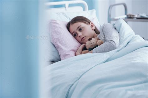 Sick Girl In Hospital Bed Stock Photo By Bialasiewicz Photodune