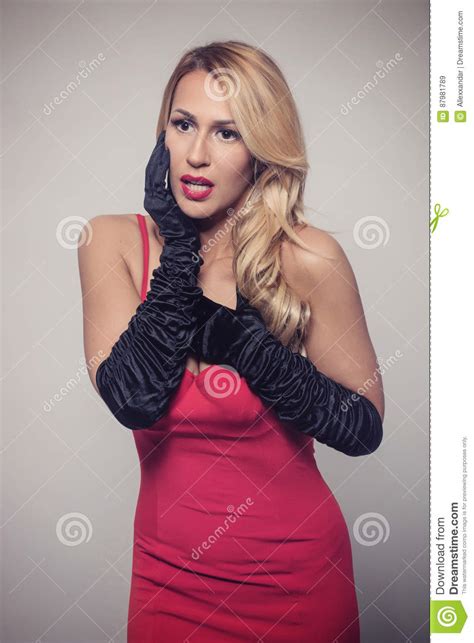Young Gorgeous Caucasian Blonde In Red Dress Retro Look Stock Image