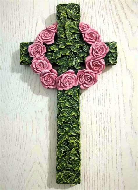 A cream wooden cross painted with swirl patterns. Christian Decor Wall Crosses Creative home accessories Wreath cross Wall hangings Christian ...