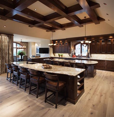 Dark hardwood flooring, brown floors, exposed beams and a vaulted ceiling photo of a medium sized contemporary open plan dining room in london with grey walls, dark hardwood flooring, a standard fireplace and brown floors. Traditional Kitchen | Light grey wood floors, Dark brown ...