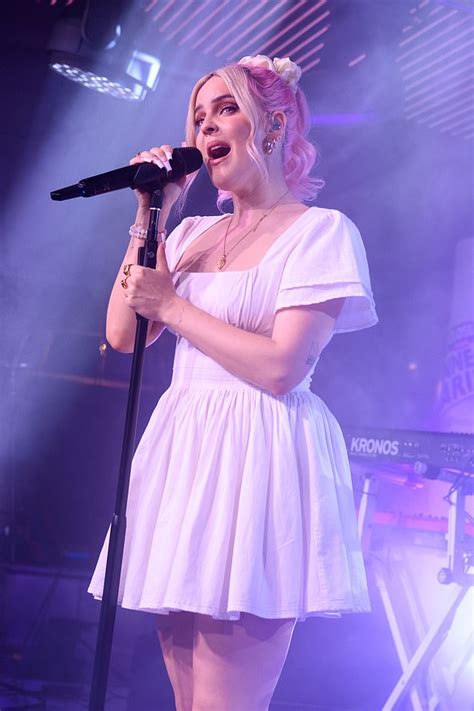 Anne Marie Looks Typically Stylish In White Mini Dress Belting Out Her