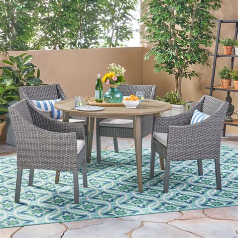 Resin outdoor dining set with 6 armchairs and one extandable table. Jon Outdoor 5 Piece Acacia Wood and Wicker Dining Set with ...