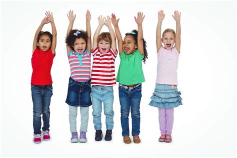 Premium Photo Small Group Of Kids Standing Together With Arms Raised