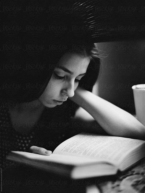 Concentrated Woman Reading Book By Stocksy Contributor Alexandr Ivanets Stocksy