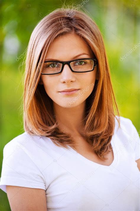 Ortrait Of Young Woman Wearing Glasses — Stock Photo © Bestphotostudio