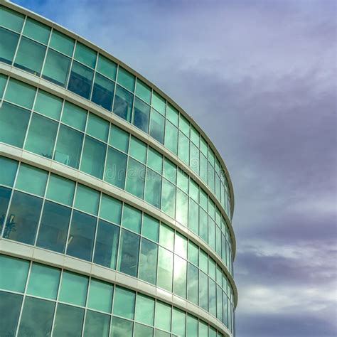 Clear Square Exterior View Of A Modern Office Building With Reflective