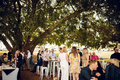 new farm wedding with two grooms beneath the fig tree with love brisbane wedding decorators