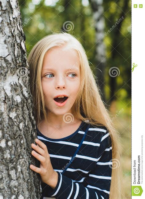 Cute Blonde Little Girl Portrait Near Tree Birch Stock