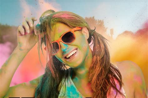 Carefree Cheerful Woman Covered In Rainbow Colored Powder Celebrating