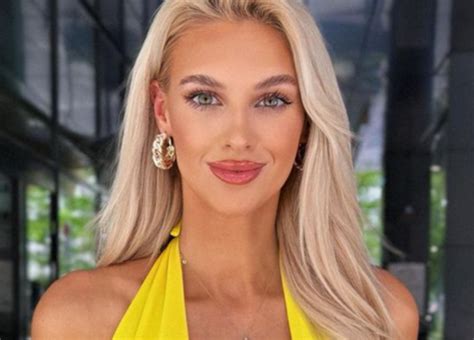 veronika rajek shows off massive cleavage in a yellow low cut top while on her euro tour