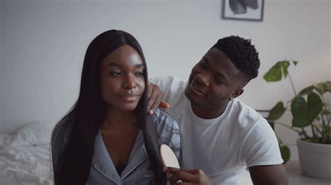 Care Of Loving Spouses Babe Caring African American Husband Combing Hair Of Black Wife