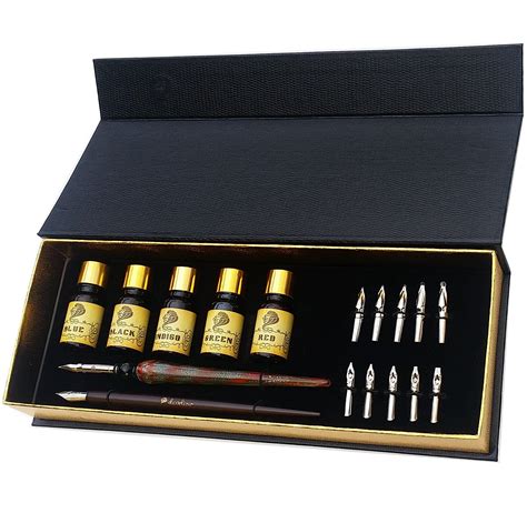 A Set Of Pens And Ink Bottles In A Black Box With Gold Trimmings