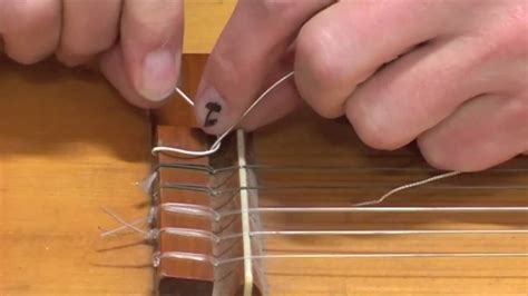 Should i change the strings on a new guitar? Guitar Lessons: How to replace and put on classical guitar ...