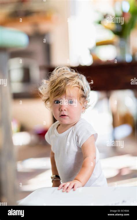 Surprised Caucasian Baby Boy Standing Indoors Stock Photo Alamy