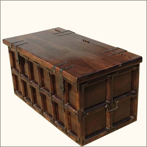Decorated with an old world map print coffee table with storage, and studded detail the bar trunk coffee table offers a historical feel to enhance home decor. Kokanee Beaufort Primitive Solid Wood & Iron Coffee Table ...