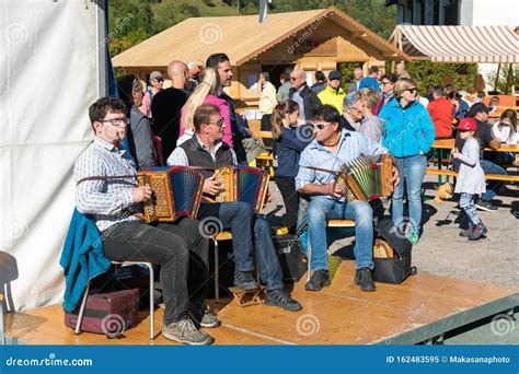 Musical Trio Playing Typical Swiss Country Music At A Village Festival