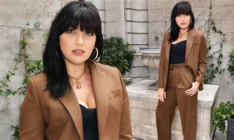 daisy lowe showcases her ample assets in a busty black top at paul and joe s london fashion week show