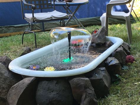 Garden art upcycle upcycle garden old bathtub cast iron bathtub recycled garden mosaic water fountain and plants local garden store. We had a old bath tub and turned it into a bathtub ...