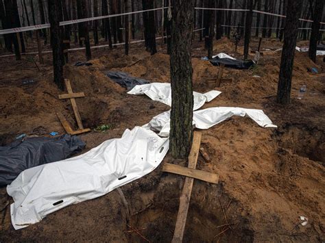 Photos Grim Exhumations Continue At Mass Grave In Ukraine Russia