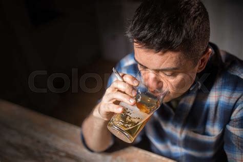 Drunk Man Drinking Alcohol And Smoking Cigarette Stock Image Colourbox