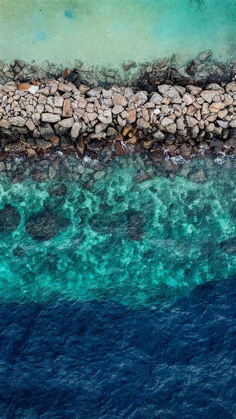 Download 1080x1920 Wallpaper Blue Green Water Aerial View Rocks