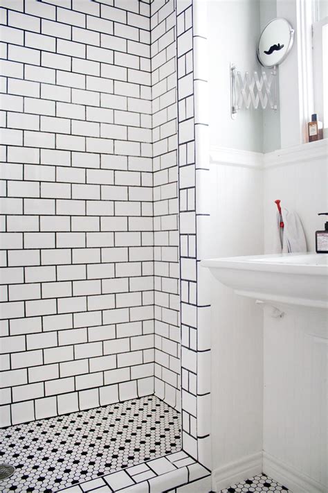 Larger subway tiles will lend a more contemporary vibe to a bathroom, while still retaining a sense of timelessness. Eric's Stylish, Sunshine-Filled House | Shower floor ...