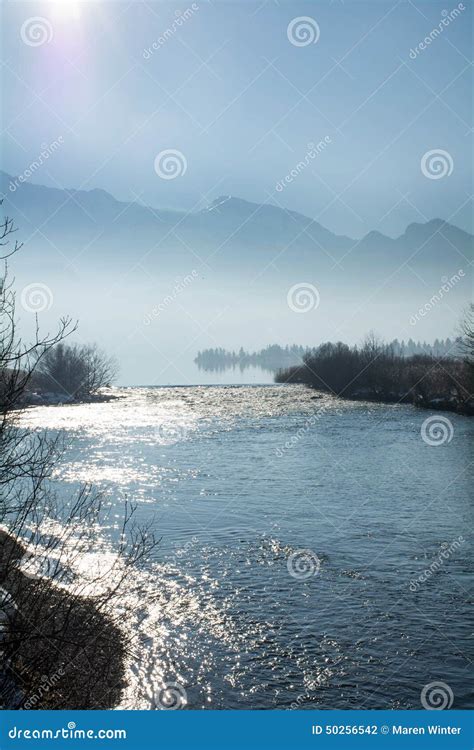 Blue Lansdcape Reflecting River And Mountains With Fog In The B Stock