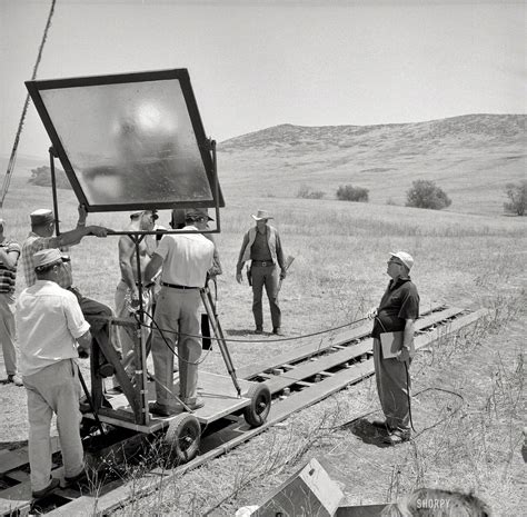1957. "Actor James Arness filming on location for the television series