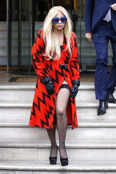 leggy lady gaga shows off a racy hint of thigh as she reveals her stocking covered pins in