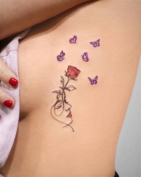 Flower Head Woman And Butterflies Tattooed On The Side