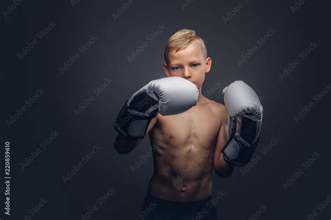 Shirtless Boy Boxer With Blonde Hair Wearing Boxing Gloves Workout In A