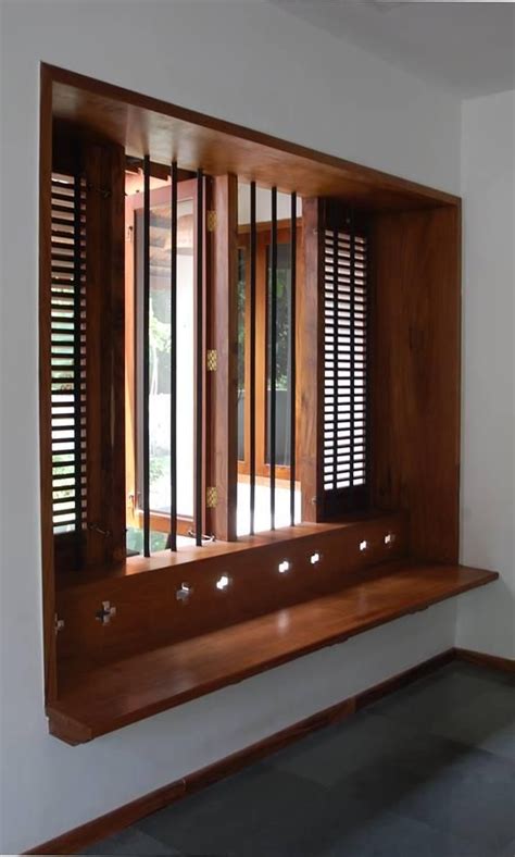 Kerala Style Wooden Window Frame Designs