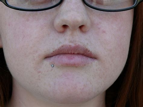 The difference between a monroe and madonna piercing is the side of the face where the labret is placed; Bottom lip piercing Pain, Aftercare, Variations, Pictures ...