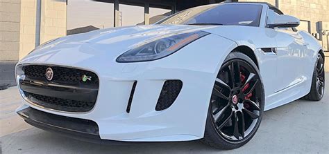 Black bumper insert, chrome side windows trim and black rear window trim, clearcoat paint, composite/aluminum panels, cornering lights, fully automatic projector beam led low/high beam daytime running. White Jaguar F-Type R | Blackout Package | Powder Coated ...